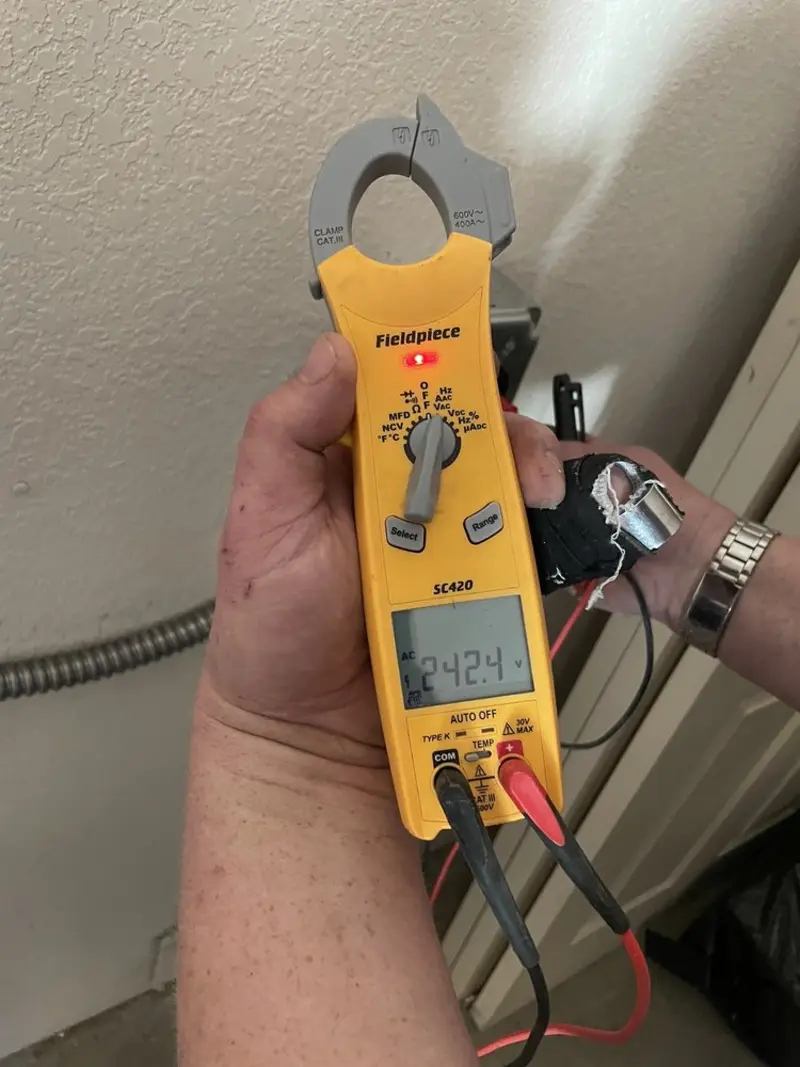 Voltage testing with clamp meter during Whole House Surge Protector in Cloquet